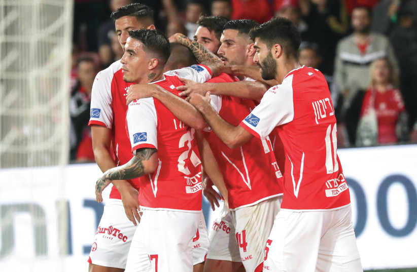 HAPOEL BEERSHEBA players celebrate the club’s second goal in its 2-0 victory over Maccabi Netaya on Sunday night in Israel Premier League action (photo credit: DANNY MAROM)
