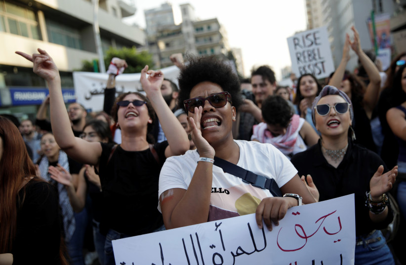 Demonstrators shout slogans at a feminist march during ongoing anti-government protests in Beirut (photo credit: REUTERS)