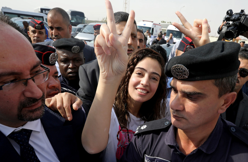 Jordanian citizen Hiba Labadi gestures upon her release by Israel, at the King Hussein Bridge crossing near Amman, Jordan (photo credit: REUTERS/MUHAMMAD HAMED)