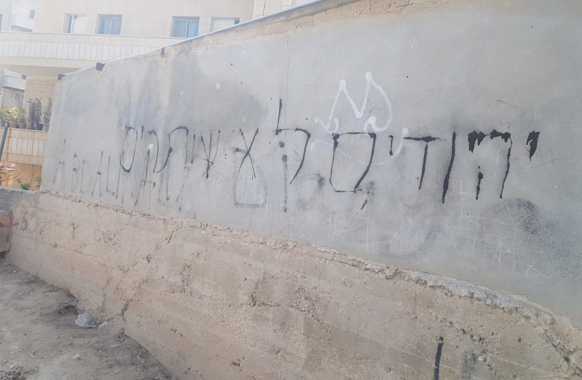 Cars and homes were vandalized in the Arab village of Hizma in the West Bank. (photo credit: AMER ARURI)