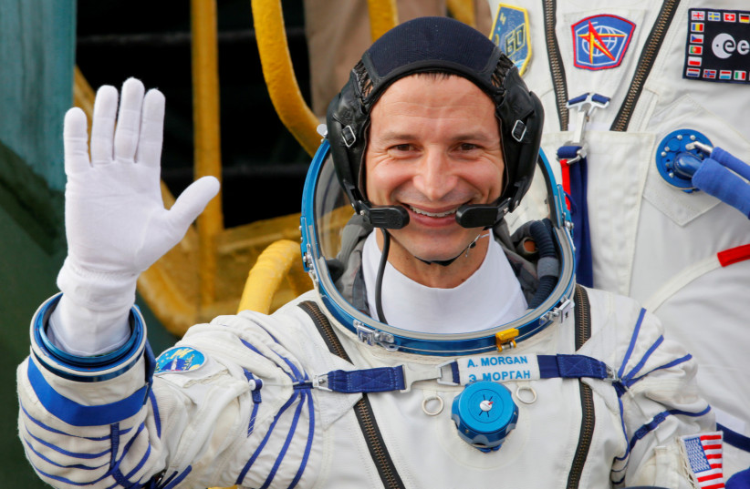 U.S. astronaut Andrew Morgan, crew member of the mission to the International Space Station (ISS), waves as he boards prior the launch of Soyuz MS-13 spacecraft Baikonur cosmodrome, Kazakhstan, July 20, 2019 (photo credit: DMITRI LOVETSKY/POOL)
