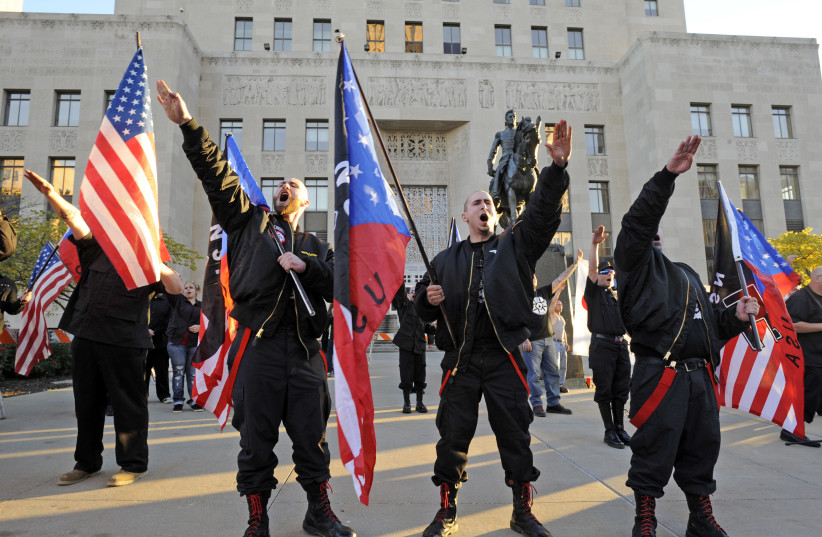 A Nazi's salute at a neo-Nazi rally in Kansas City, Missouri. (Dave Kaup/Reuters) (photo credit: DAVE KAUP / REUTERS)