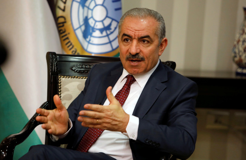 Palestinian Prime Minister Mohammad Shtayyeh gestures during an interview with Reuters in his office in Ramallah, in the Israeli-occupied West Bank, June 27, 2019 (photo credit: RANEEN SAWAFTA/ REUTERS)