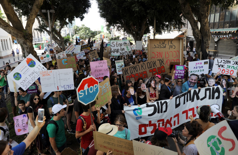 Demonstrators protest in Tel Aviv on September 27 to demand ection on climate change (photo credit: REUTERS)