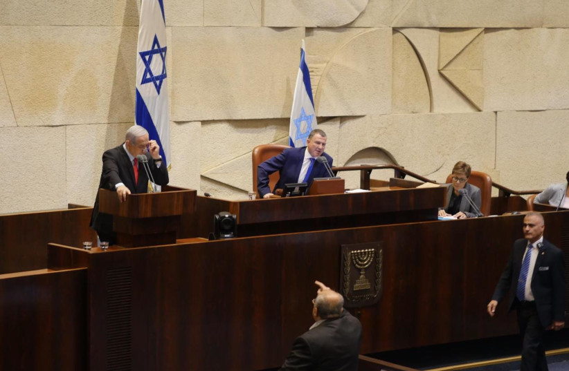Joint List MK Ahmad Tibi (below) yells at Prime Minister Benjamin Netanyahu at the Knesset on Wednesday (photo credit: KNESSET)