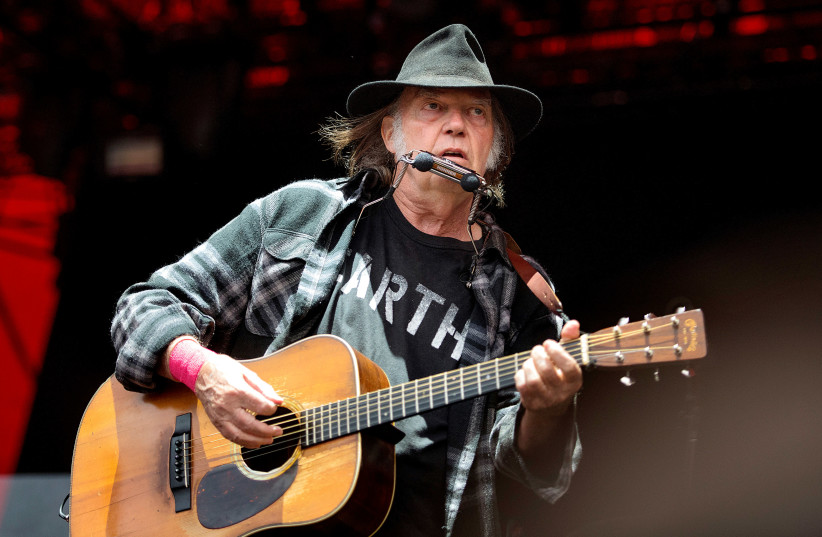 Canadian singer-songwriter Neil Young performs at the Orange Stage at the Roskilde Festival in Roskilde, Denmark, on July 1, 2016 (photo credit: SCANPIX DENMARK/NILS MEILVANG/VIA REUTERS)