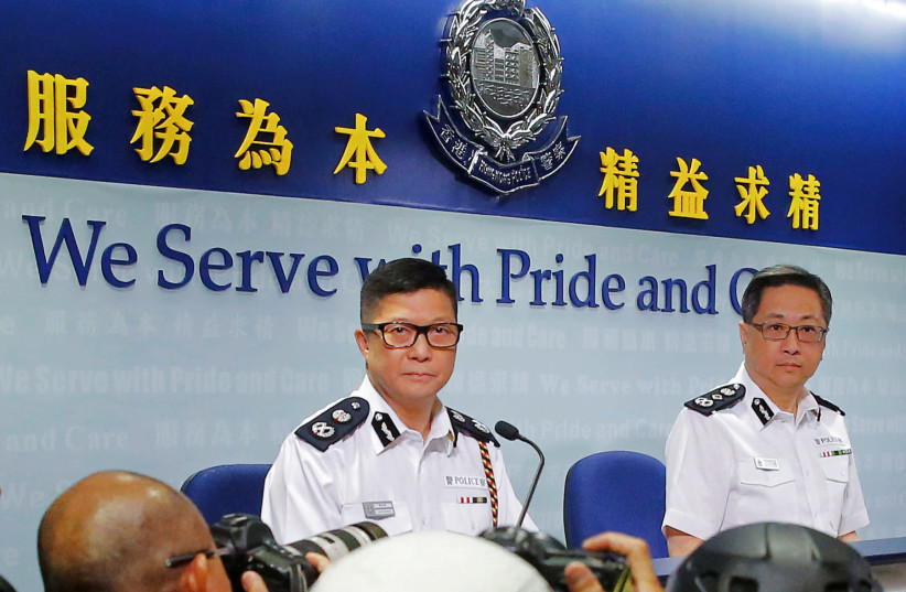 Deputy Commissioner of Police Tang Ping-keung and Commissioner of Police Lo Wai-chung attend a news conference in Hong Kong (photo credit: REUTERS/THOMAS PETER)