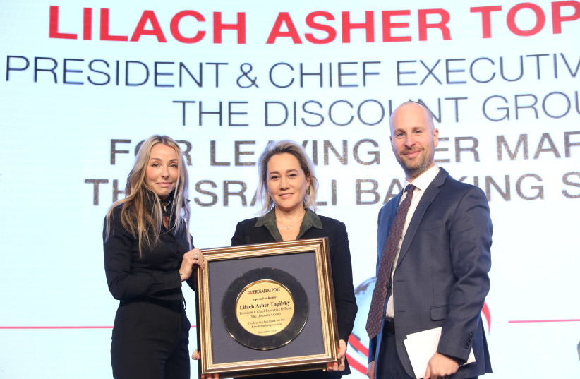 Lilach Asher Topilsky, president and CFO of the Discount Group, is given an award at The Jerusalem Post Diplomatic Conference. (photo credit: MARC ISRAEL SELLEM/THE JERUSALEM POST)