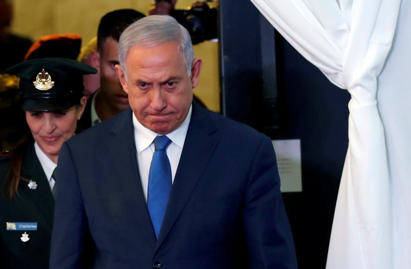 FILE PHOTO:Israeli Prime Minister Benjamin Netanyahu looks on as he arrives to review an honor guard with his Ethiopian counterpart Abiy Ahmed during their meeting in Jerusalem September 1, 2019 (photo credit: REUTERS/RONEN ZVULUN/FILE PHOTO)