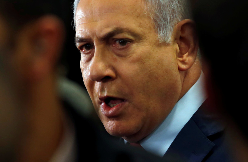 Israeli Prime Minister Benjamin Netanyahu speaks to the media at the Knesset, Israel's parliament, in Jerusalem (photo credit: RONEN ZVULUN/REUTERS)