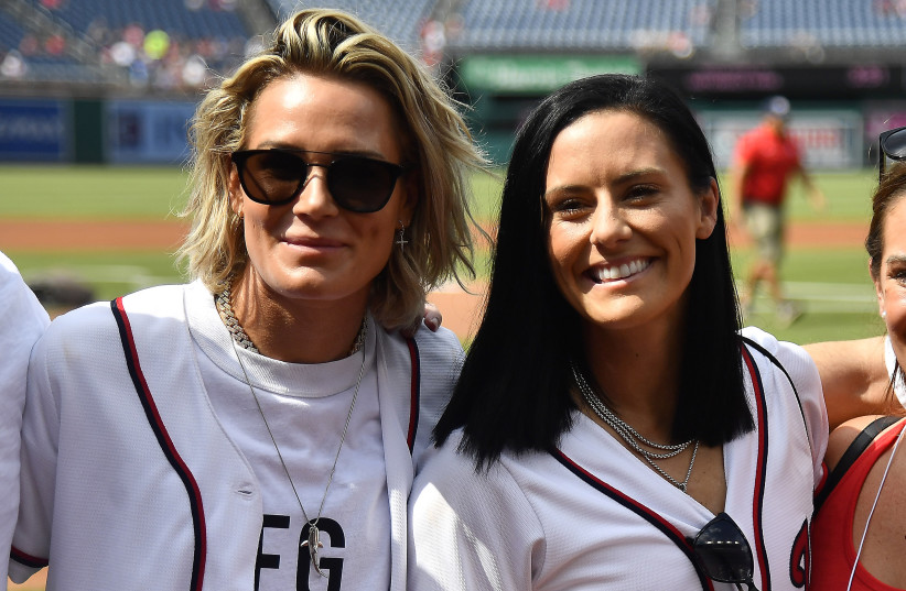 Jul 25, 2019; Washington, DC, USA; US Women's National soccer team members Ali Krieger and Ashlyn Harris on the field before the game between the Washington Nationals and the Colorado Rockies at Nationals Park (photo credit: BRAD MILLS-USA TODAY SPORTS)