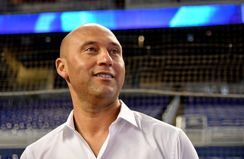 Miami Marlins chief executive officer Derek Jeter addresses the media prior to the game between the Miami Marlins and the Atlanta Braves at Marlins Park (photo credit: JASEN VINLOVE-USA TODAY SPORTS / VIA REUTERS)