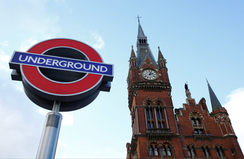 The St Pancras clock tower is seen by an Underground tube sign, London, Britain, January 26, 2018 (photo credit: REUTERS)