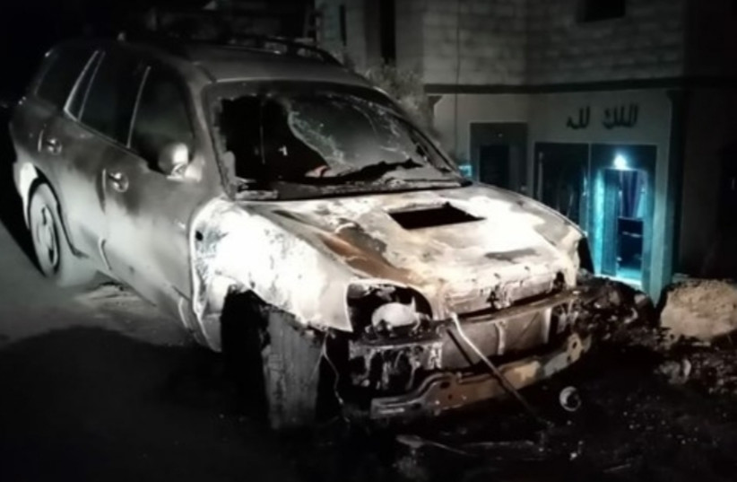 A burnt car as the result of a price tag attack in Beit Dajan, Qabalan, West Bank (photo credit: ARAB MEDIA)