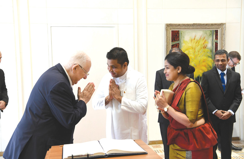 PRESIDENT REUVEN RIVLIN with Sri Lankan Ambassador Saddha Waruna Wilpatha and his wife (photo credit: AMOS BEN-GERSHOM/GPO)