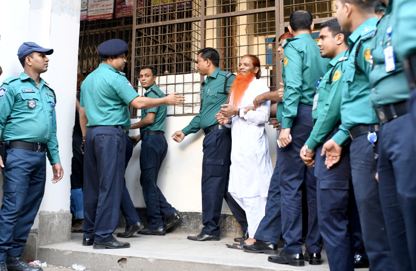 One of the accused of Holey Artisan Bakery attack is led to the court in Dhaka, Bangladesh, November 27, 2019 (photo credit: REUTERS/STRINGER)