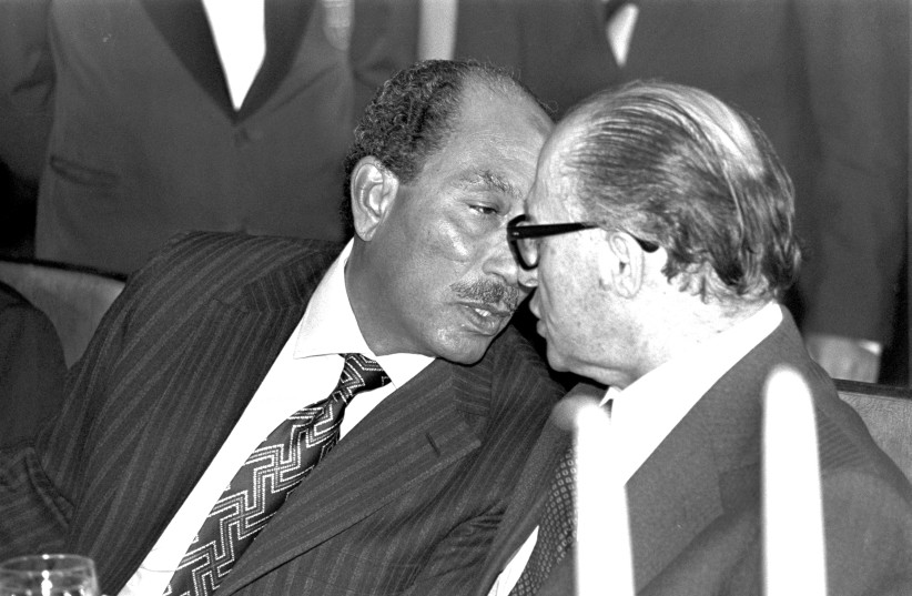 EGYPTIAN PRESIDENT Anwar Sadat (left) and prime minister Menachem Begin deep in conversation at Jerusalem’s King David Hotel.  (credit: Wikimedia Commons)