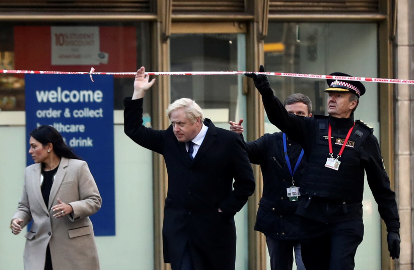 Britain's Prime Minister Boris Johnson, Home Secretary Priti Patel and City of London commissioner Ian Dyson arrive at the scene of a stabbing on London Bridge, in which two people were killed, in London, Britain, November 30, 2019. (photo credit: REUTERS/SIMON DAWSON)