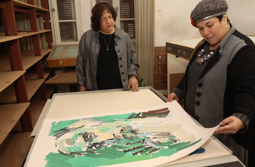 ARTIST HEDDY BREUER ABRAMOWITZ (center) and Studio of Her Own founder Zipi Mizrachi look through pieces of original artwork left behind by the late Pinhas Litvinovsky.  (photo credit: MARC ISRAEL SELLEM)