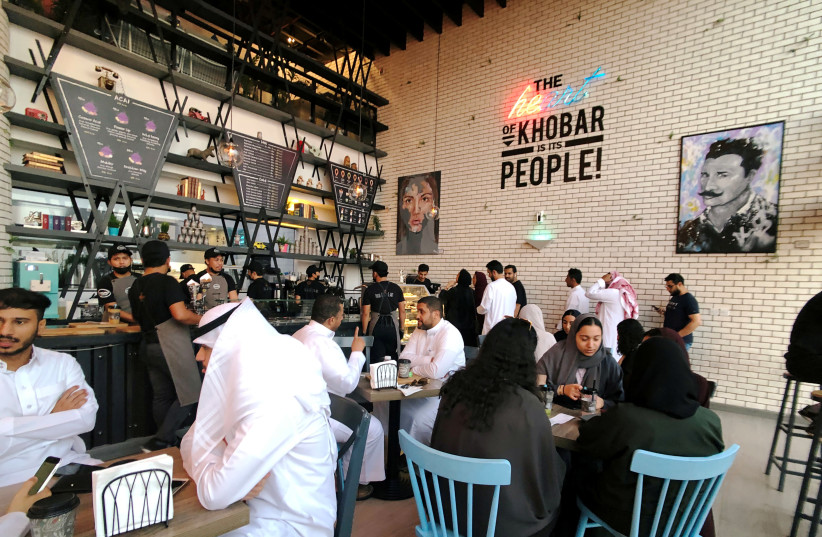 FILE PHOTO: Women sit among men in a newly opened cafe in Khobar, Saudi Arabia, August 2, 2019 (photo credit: REUTERS/HAMAD I MOHAMMED/FILE PHOTO)