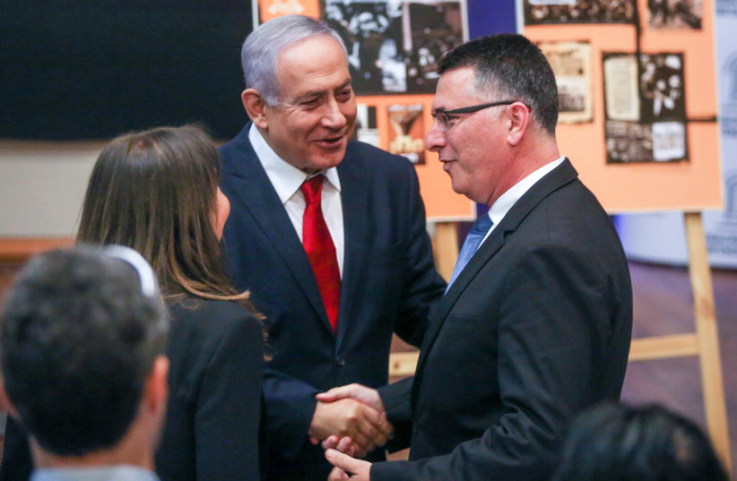 Prime Minister Benjamin Netanyahu with Gideon Sa’ar in the Knesset (photo credit: MARC ISRAEL SELLEM)