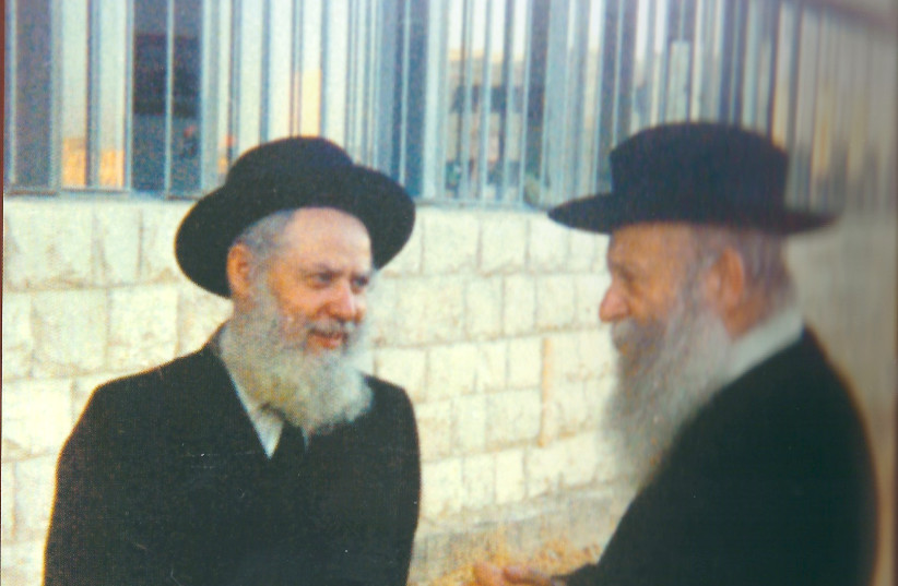 RABBI ZVI YEHUDA KOOK (right) – whose father Rabbi Abraham Isaac Kook founded Mercaz HaRav – stands outside the Jerusalem yeshiva with Rabbi Avraham Shapira, who went on to lead the yeshiva, in 1980. Rabbi Zvi Yehuda hung a picture of Herzl in his study next to pictures of the Chofetz Chaim and the  (photo credit: Wikimedia Commons)