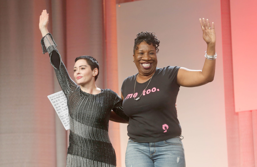 TARANA BURKE, activist and founder of the #MeToo movement (right), introduces actress Rose McGowan to speak during the opening session of the three-day Women’s Convention in Detroit in 2017. (photo credit: REUTERS)