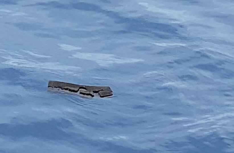 Debris believed by the Chilean Air Force to be from a Hercules C-130 military cargo plane that crashed this week and went missing, is seen in the Drake Passage or Sea of Hoces, Mid-Sea in this undated handout received on December 11, 2019 (photo credit: FUERZA AEREA DE CHILE (CHILEAN AIR FORCE) /VIA REUTERS)