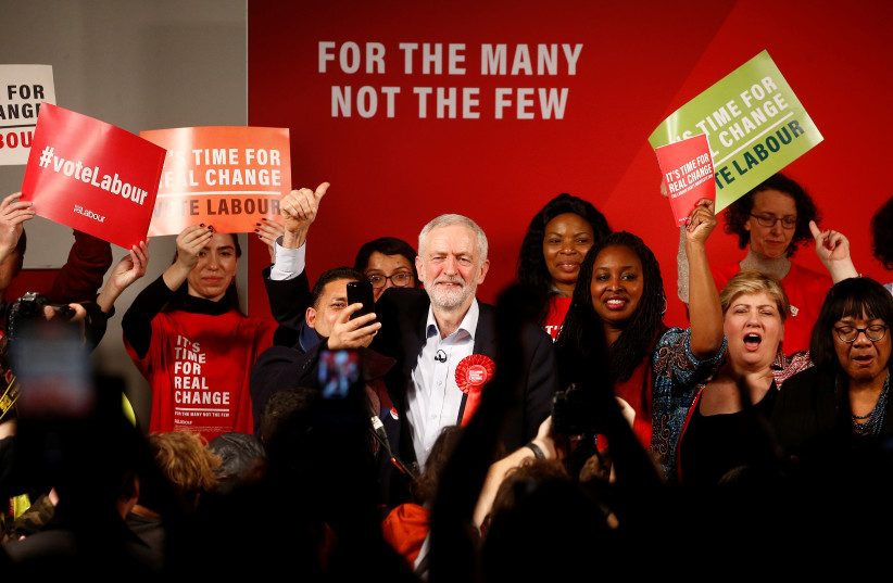  Britain's opposition Labour Party leader Jeremy Corbyn gives a thumbs up during a final general election campaign event in London. (photo credit: HENRY NICHOLLS/REUTERS)