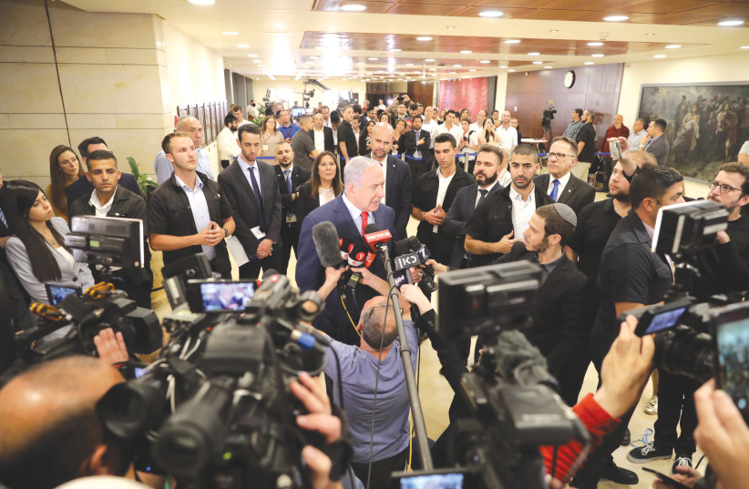 PRIME MINISTER Benjamin Netanyahu addresses the media after the vote that dissolved the Knesset in May and sent Israel to a second election.  (photo credit: MARC ISRAEL SELLEM/THE JERUSALEM POST)