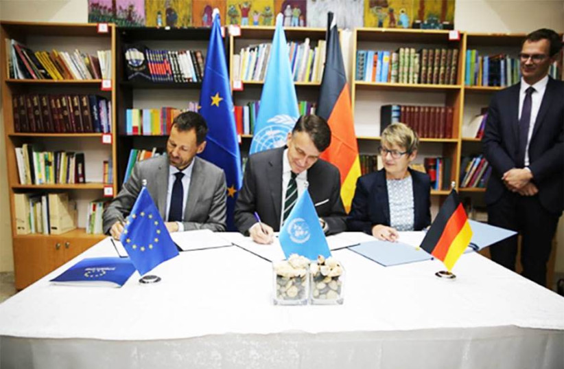 Acting EU Representative Tomas Niklasson (left), Cornelia Dinter from Germany’s KfW Development Bank (right) and Acting UNRWA Commissioner-General Christian Saunders (center) signed additional contribution agreements for UNRWA at a signing ceremony in the UNRWA Preparatory Girls’ School in Silwan (photo credit: UNRWA/MARWAN BAGHDADI)