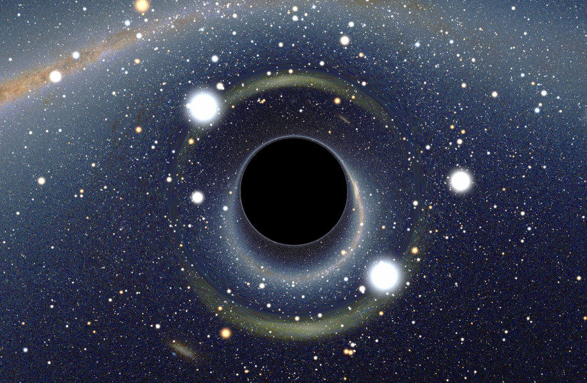 A simulated image of a black hole. (photo credit: Wikimedia Commons)