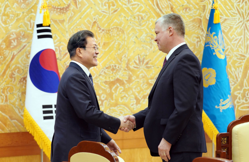 US Special Representative for North Korea Stephen Biegun is greeted by South Korean President Moon Jae-in during their meeting at the Presidential Blue House in Seoul, South Korea, December 16, 2019 (photo credit: YONHAP VIA REUTERS)