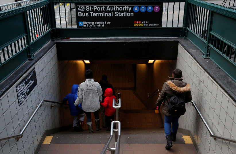 People enter the subway station by the New York Port Authority Bus Terminal following an attempted detonation during the morning rush hour, in New York City, New York, US, December 11, 2017 (photo credit: REUTERS/ANDREW KELLY)