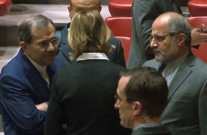 U.S. Ambassador to the United Nations Kelly Craft speaks with Iran's U.N. Ambassador Majid Takht Ravanchi in the U.N. Security Council chamber in New York City, U.S. in a still image from video taken December 19, 2019 (photo credit: REUTERS)