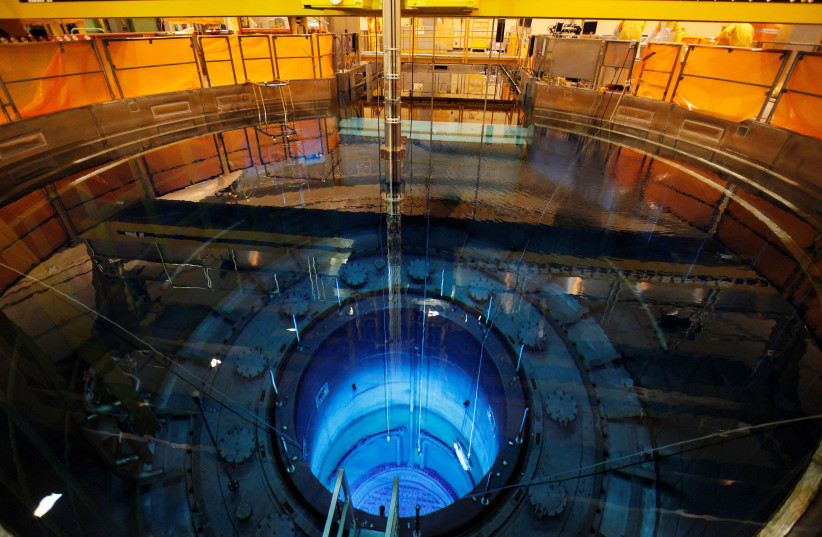 The open reactor with fuel rods are seen in a water pool inside the nuclear power plant Muehleberg during a yearly revision in Muehleberg, Switzerland August 16, 2012. (photo credit: RUBEN SPRICH / REUTERS)
