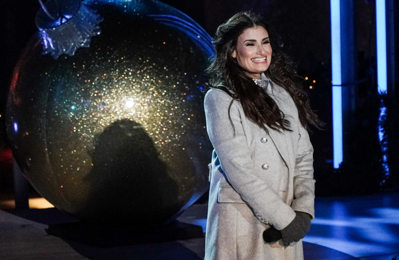 Idina Menzel performs during the Christmas tree lighting show at Rockefeller Center in the Manhattan borough of New York City, New York, U.S., December 4, 2019 (photo credit: REUTERS/JEENAH MOON)