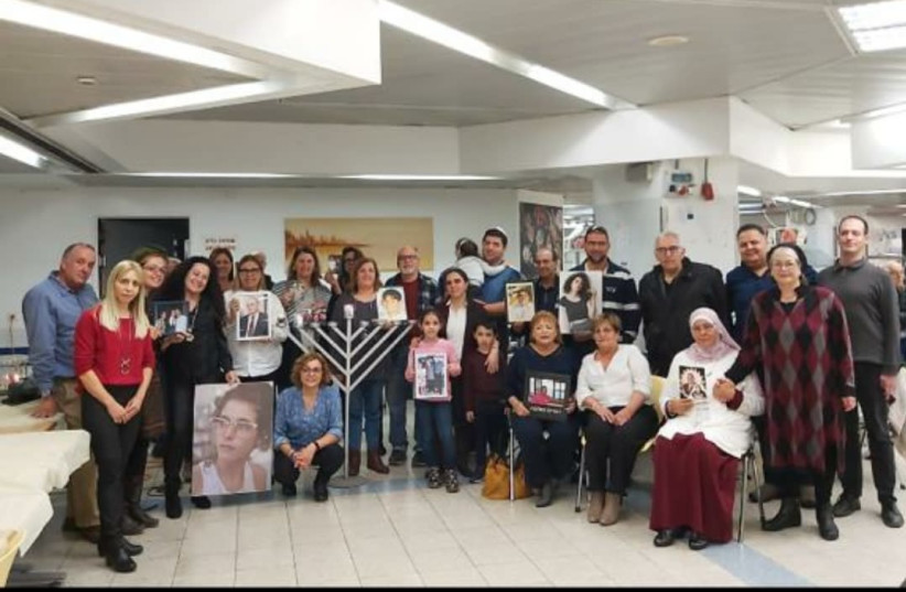 Families of organ donors gather at the National Transplant Center on the second night of Hanukkah. (photo credit: NATIONAL TRANSPLANT CENTER)