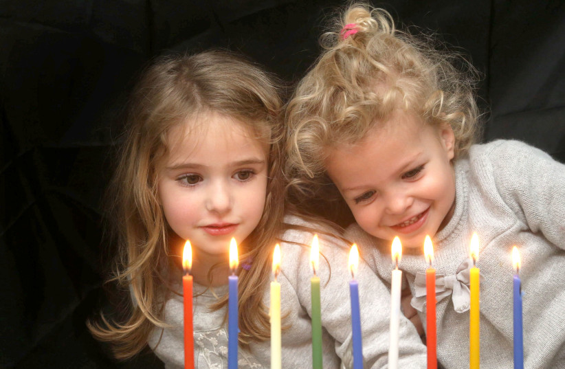 The eternal flame  in the Hanukkah candles (photo credit: MARC ISRAEL SELLEM)