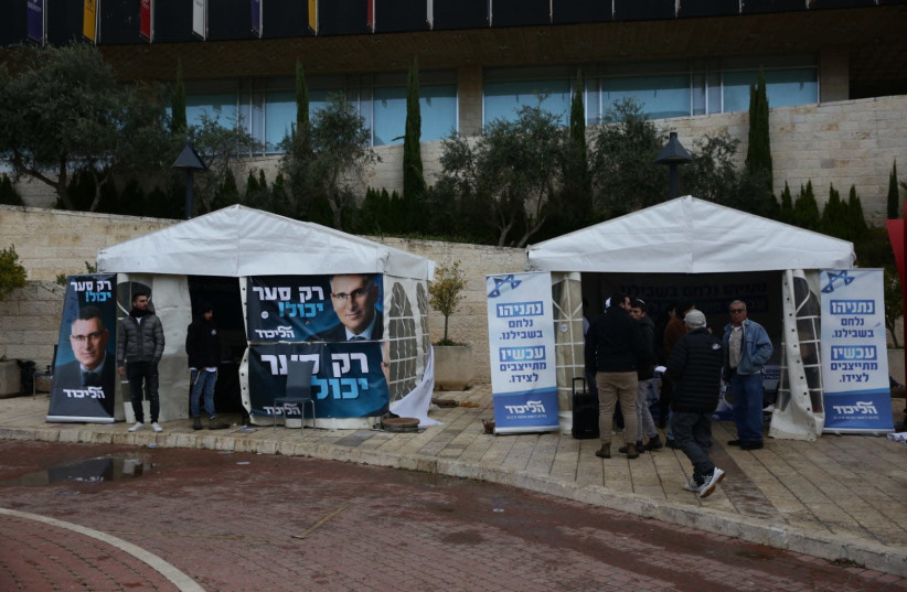 Likud members vote in the party elections, the choice is between MK Gideon Sa'ar [tent on the left] and Prime Minister Benjamin Netanyahu [tent on the right] Prime  (photo credit: EHUD AMITON/TPS)