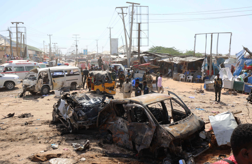 A general view shows the scene of a car bomb explosion at a checkpoint in Mogadishu, Somalia December 28, 2019 (photo credit: REUTERS/FEISAL OMAR)
