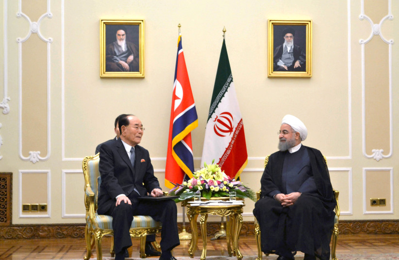 Kim Yong Nam, president of North Korea's Presidium of the Supreme People's Assembly with Hassan Rouhani, president of Iran, in Tehran (photo credit: KNCA/REUTERS)