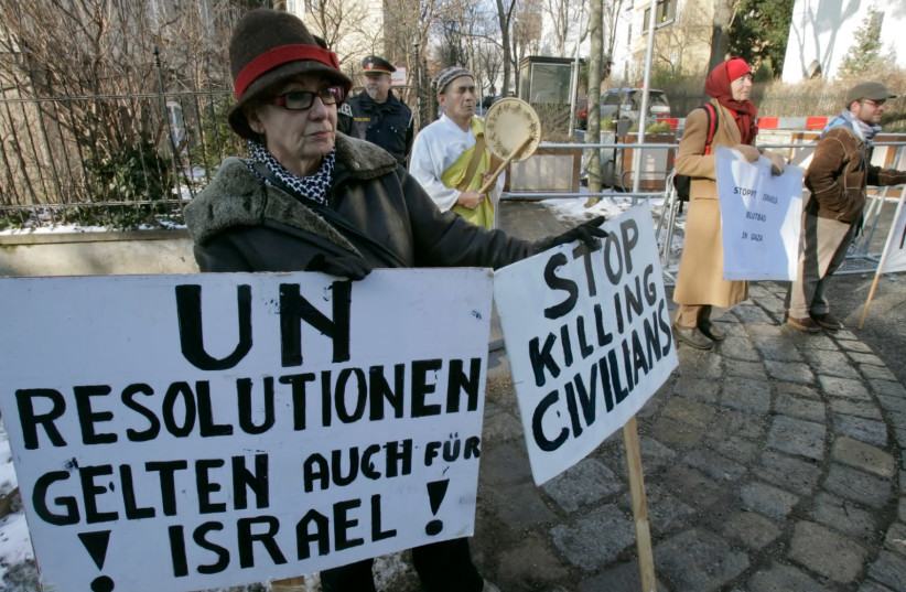 Members of the organization "Women in Black" demonstrate against Israel's offensive in Gaza in front of Israel's embassy in Vienna (photo credit: HERWIG PRAMMER/REUTERS)