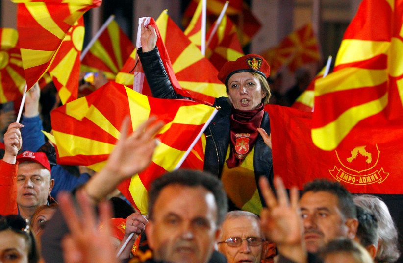 North Macedonia biggest opposition party VMRO-DPMNE supporters shout slogans, April 2019 (photo credit: OGNEN TEOFILOVSKI/REUTERS)