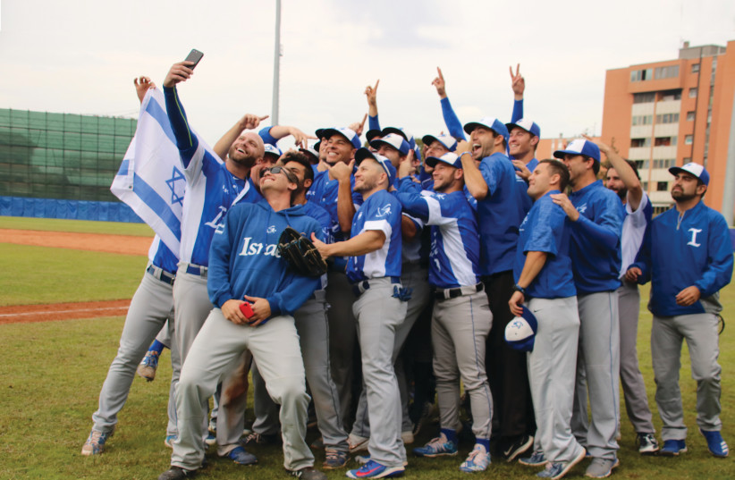 Team Israel poses for a celebratory selfie on September 22 in Parma, Italy, minutes after defeating South Africa to qualify for the Olympics. (photo credit: MARGO SUGARMAN)