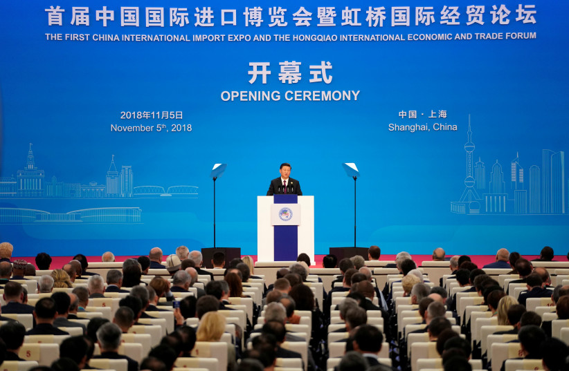 Chinese President Xi Jinping speaks at the opening ceremony for the first China International Import Expo (CIIE) (photo credit: ALY SONG/REUTERS)