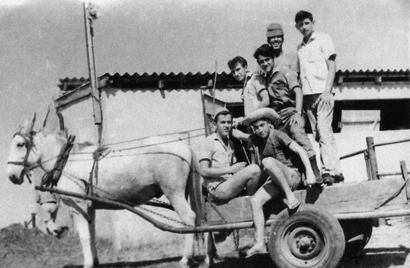 1962, KFAR HAROEH. Aharon Ze’evi Farkash, 14 (bottom left), who immigrated to Israel through Youth Aliyah from Transylvania, Romania, is photographed with his friends at The Jewish Agency’s Ben Yakir religious Youth Village. (photo credit: JEWISH AGENCY)