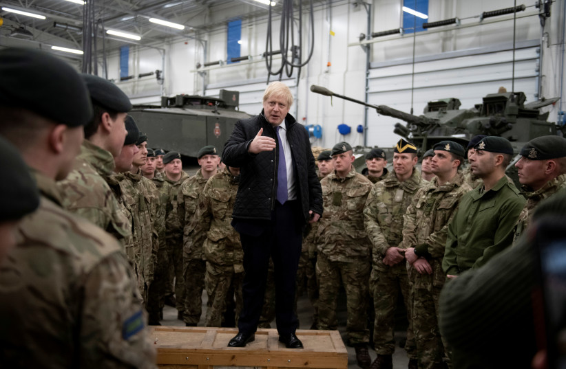 Prime Minister Boris Johnson speaks during a visit to British troops stationed in Estonia at the Tapa military base near Tallinn, Estonia December 21, 2019. (photo credit: GEOFF PUGH/POOL VIA REUTERS)