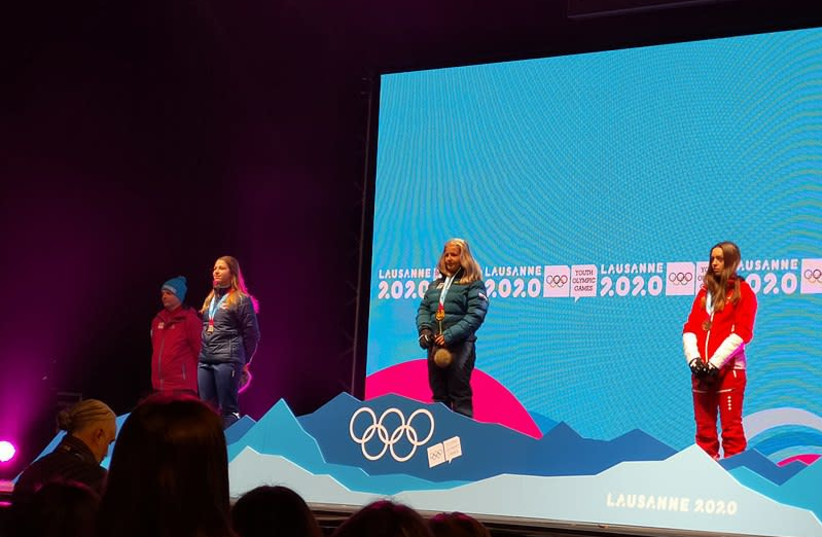 Noa Szollos stands alongside Amanda Salzgeber and Amelie Klopfenstein on the winner's podium for Girls' Alpine skiing at the 2020 Winter Youth Olympic Games in Lausanne, Switzerland. (photo credit: Wikimedia Commons)