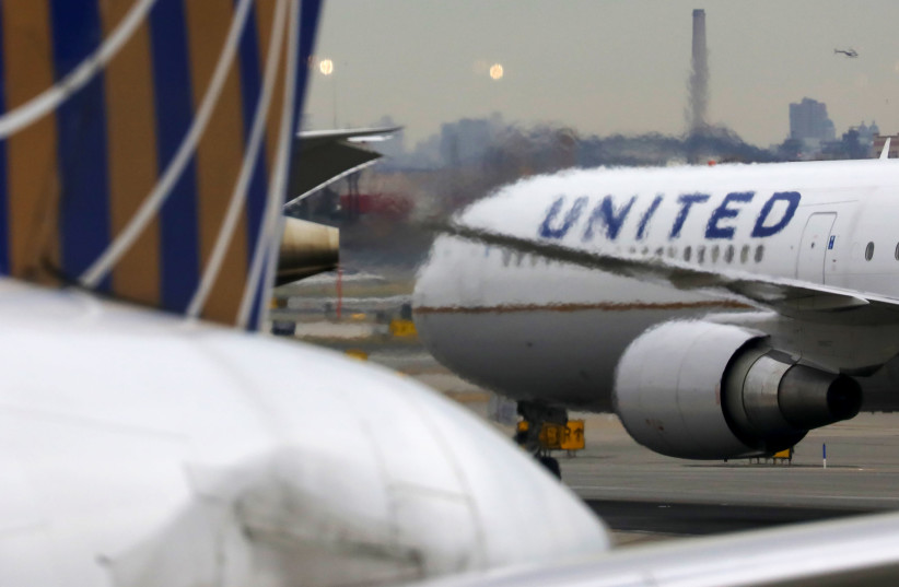 A United Airlines passenger jet taxis at Newark Liberty International Airport, New Jersey, U.S. December 6, 2019. (photo credit: REUTERS/CHRIS HELGREN)